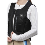 Person wearing a black back protector vest with visible branding on a white background