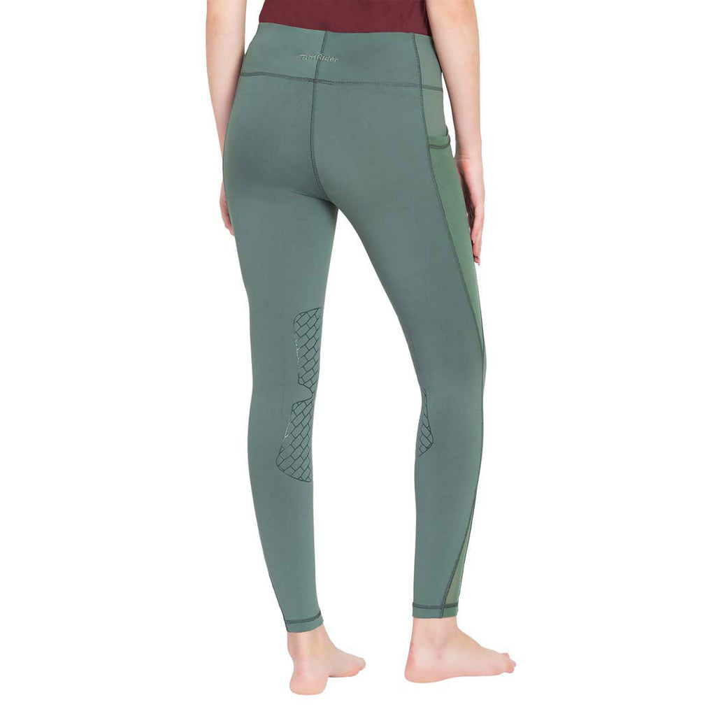Green leggings worn by a person on a white background