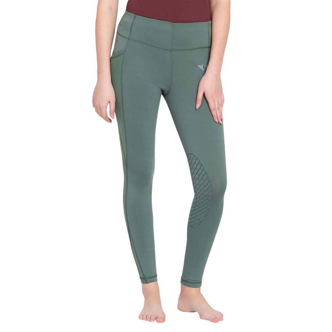Green leggings worn by a person on a white background