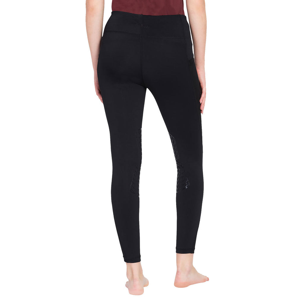 Person wearing black leggings on a white background