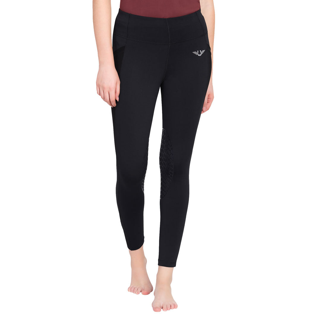 Person wearing black leggings with a brand logo on a white background