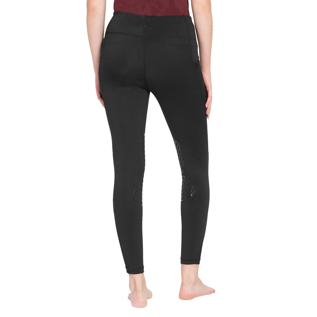 Black leggings worn by a person on a white background