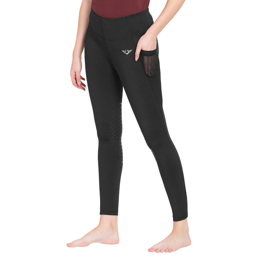 Person wearing black leggings with a brand logo on a white background