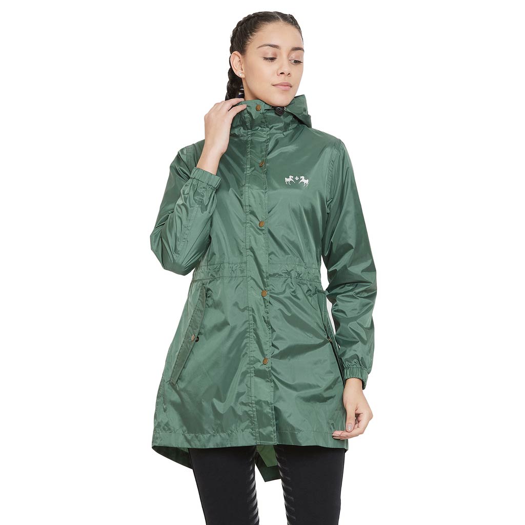 Woman wearing a green raincoat on a white background