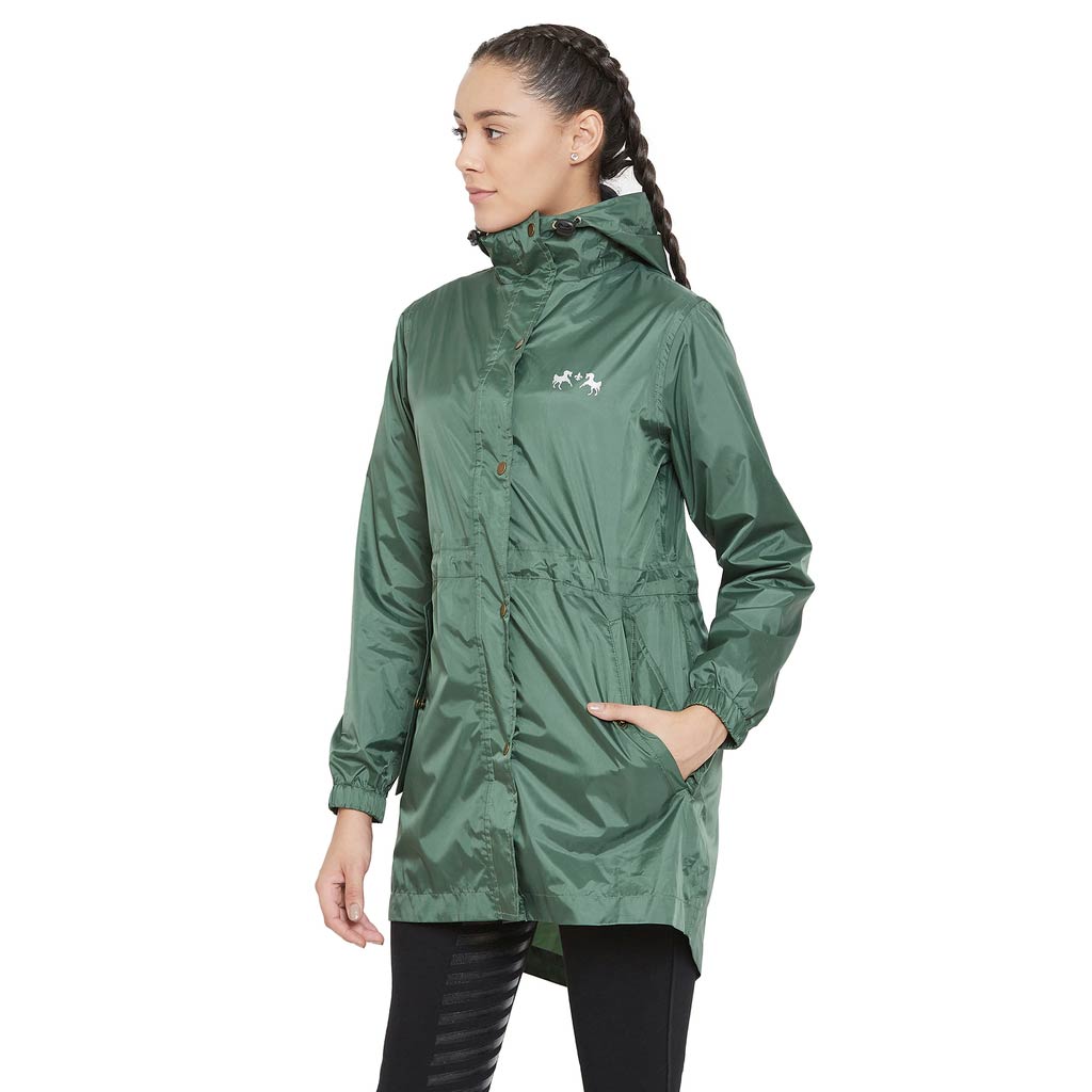 Woman wearing a green raincoat on a white background