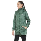 Woman wearing a green raincoat on a white background