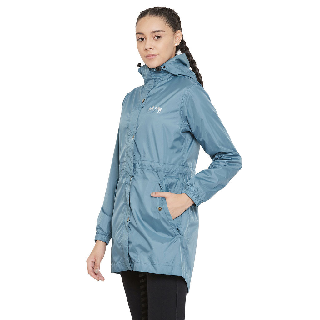 Woman wearing a blue raincoat on a white background