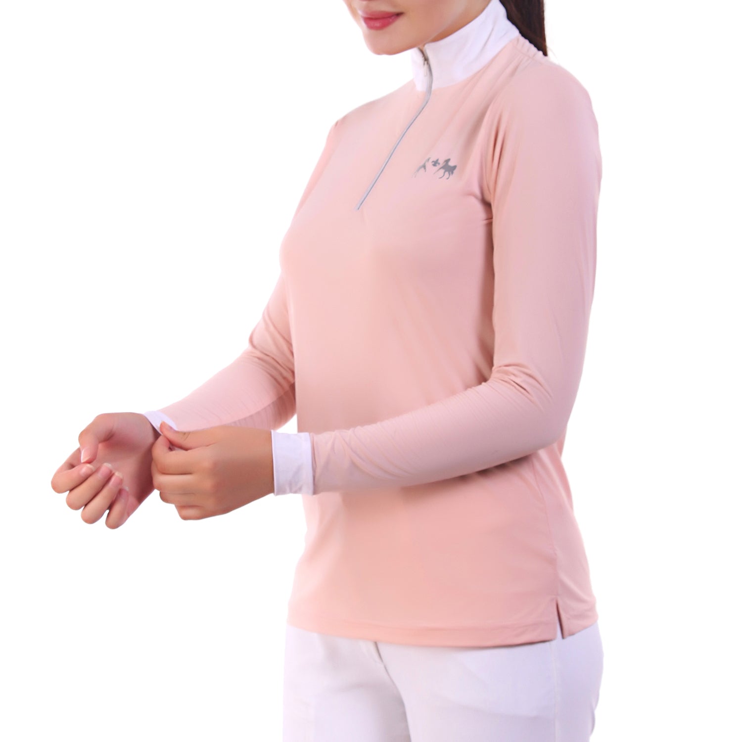 Person wearing a light pink long-sleeve top with a white collar on a white background