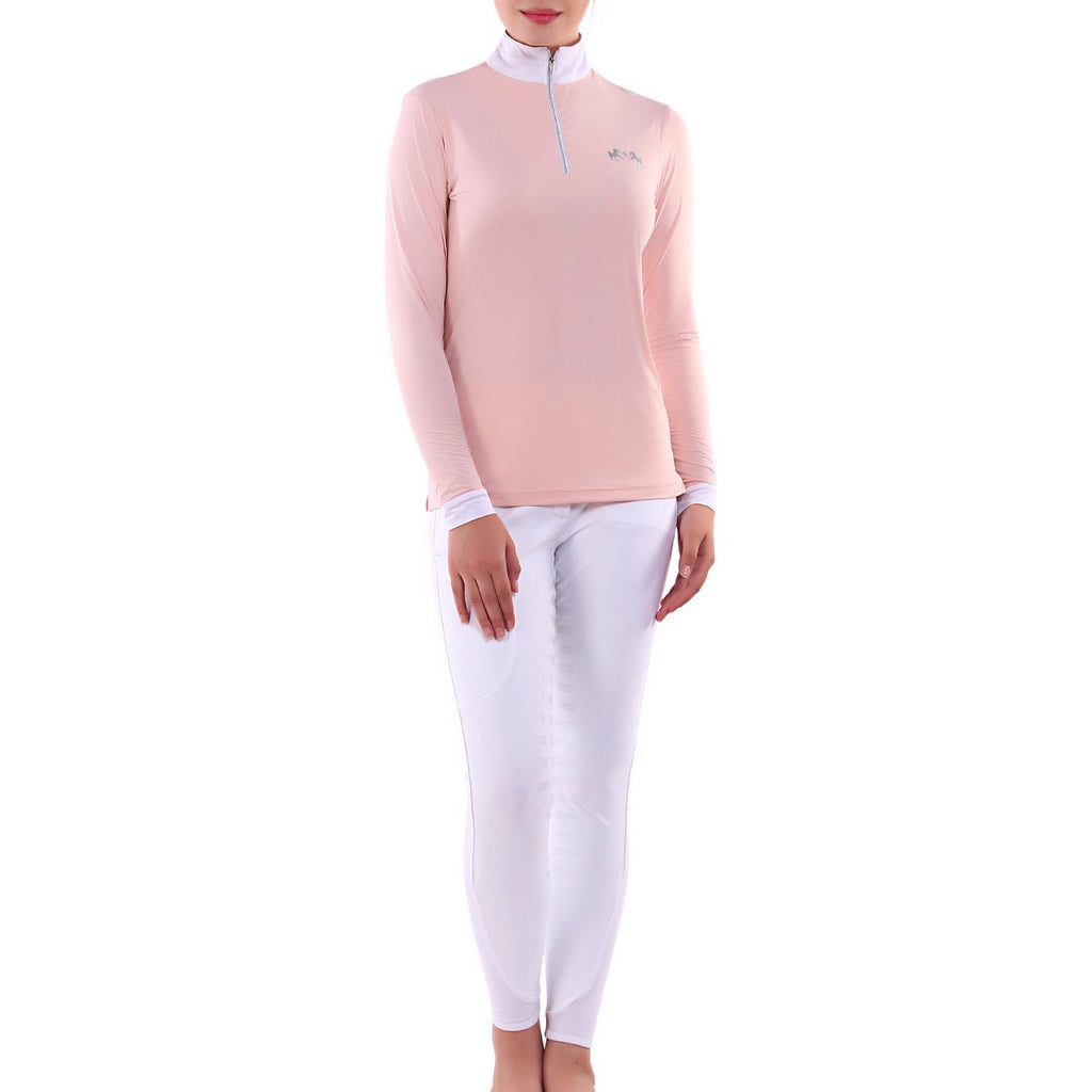 Person wearing a pink long-sleeve top and white pants on a white background