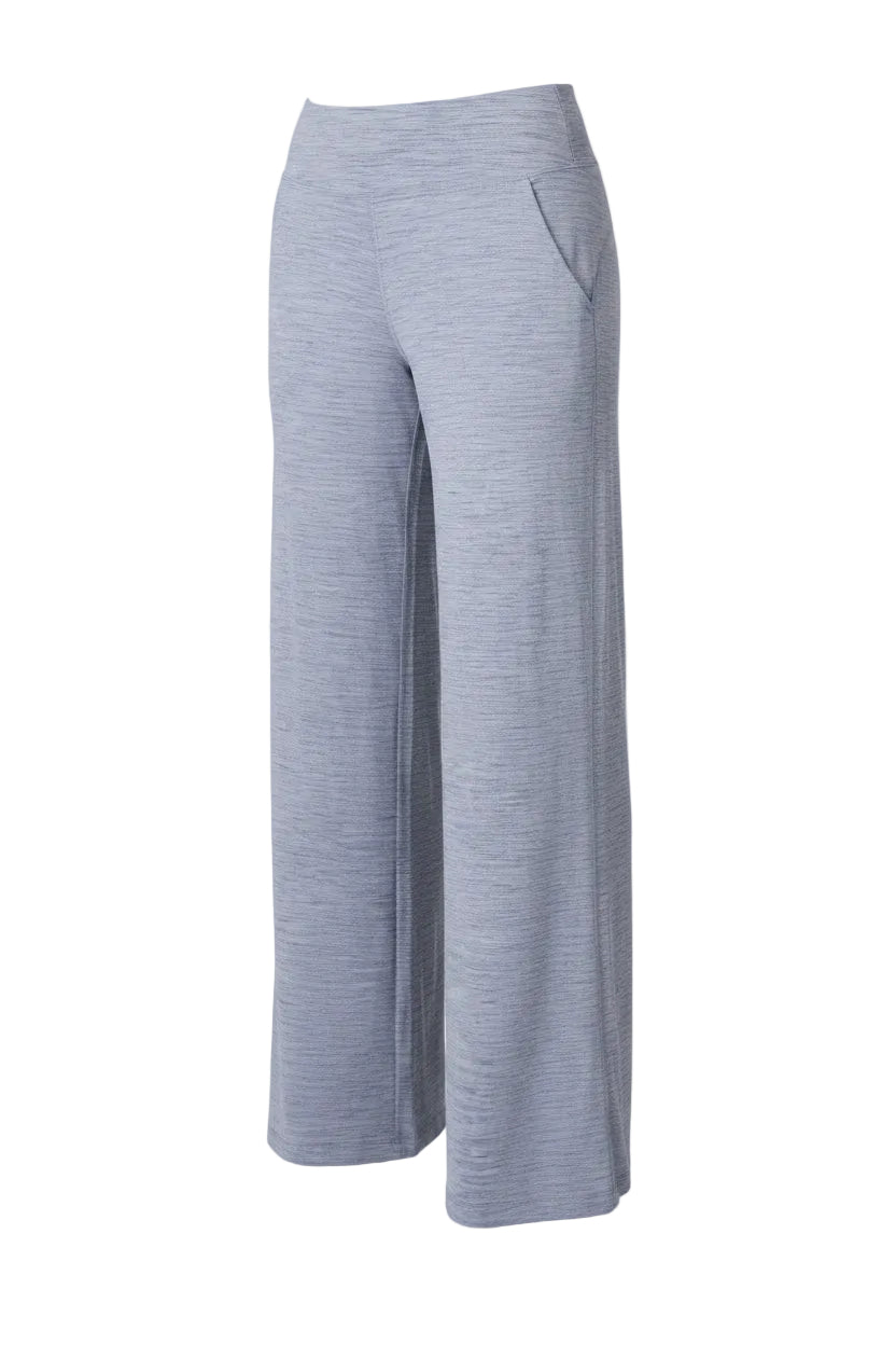 Person wearing light gray wide-leg pants on a white background
