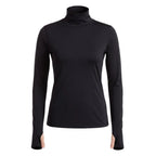 Woman wearing a black turtleneck and leggings on a white background