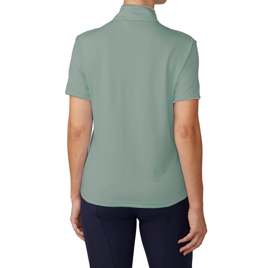 Person wearing a light green polo shirt on a white background