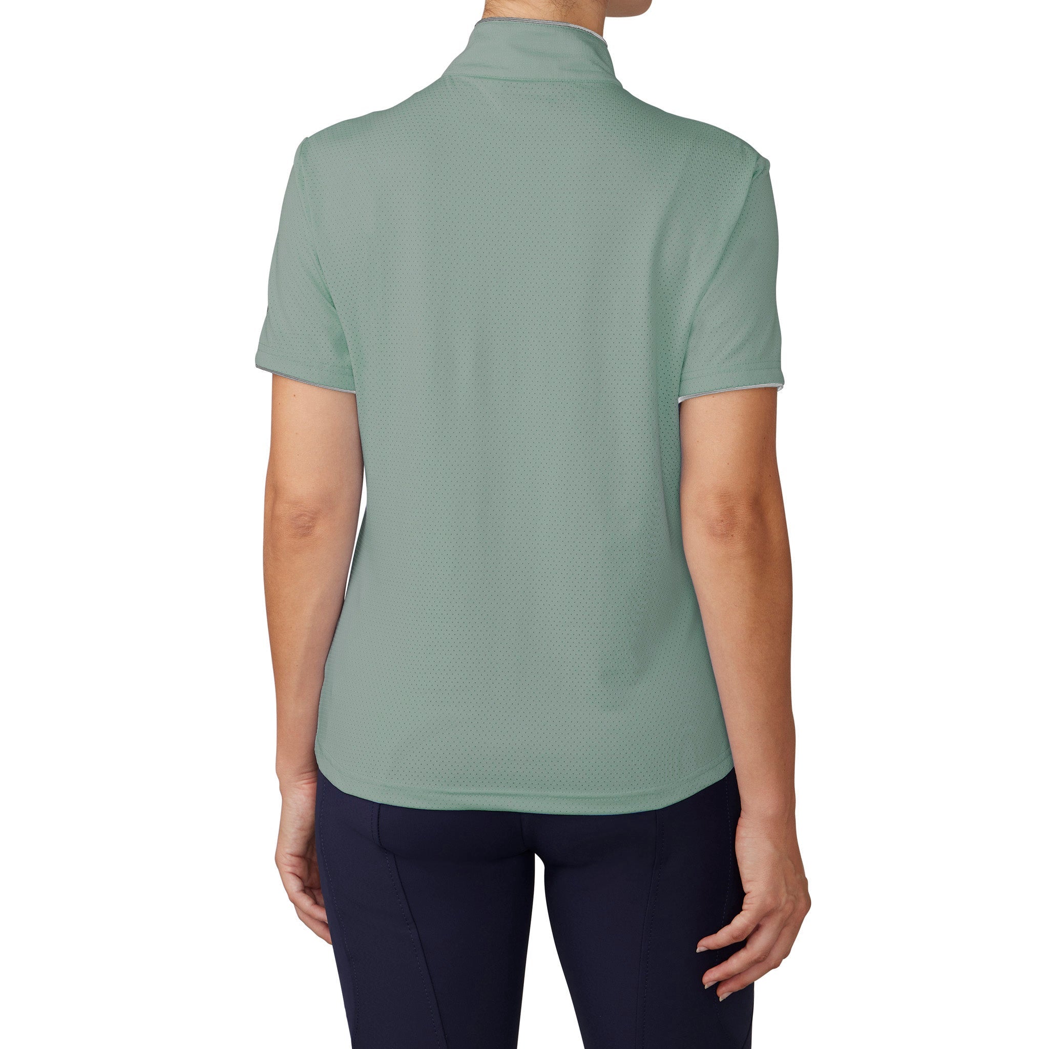 Person wearing a light green polo shirt on a white background