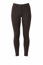 Black riding pants worn by a person on a white background