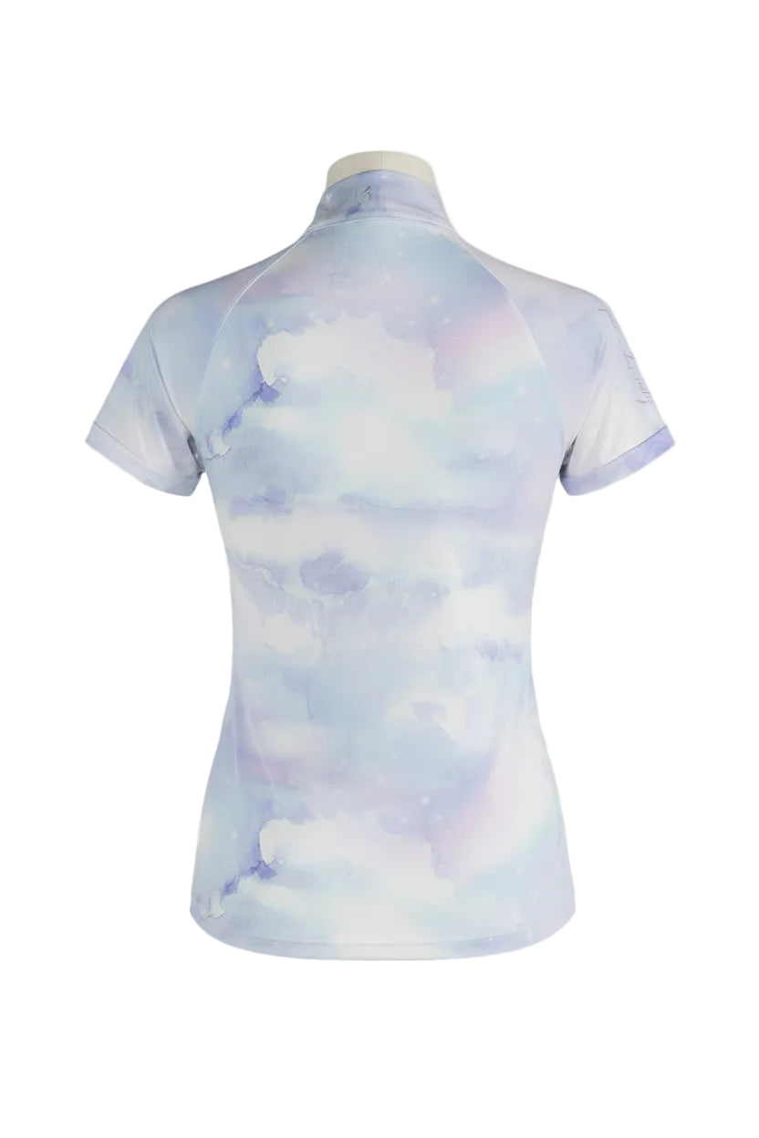 Woman wearing a cloud-patterned equestrian shirt on a gray background