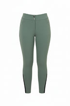 Green riding pants with a pink belt on a gray background