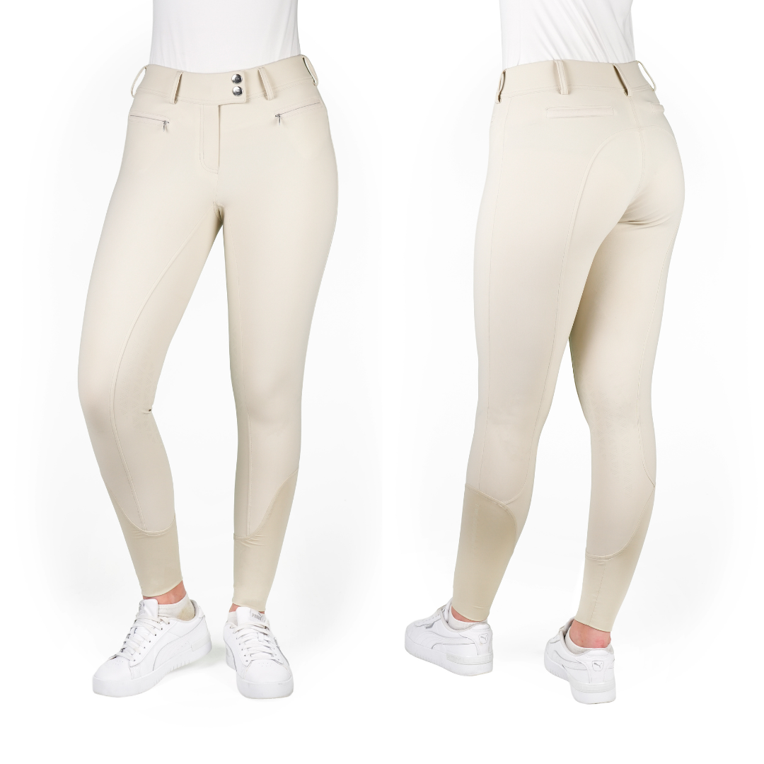 Beige riding pants worn by a person on a white background