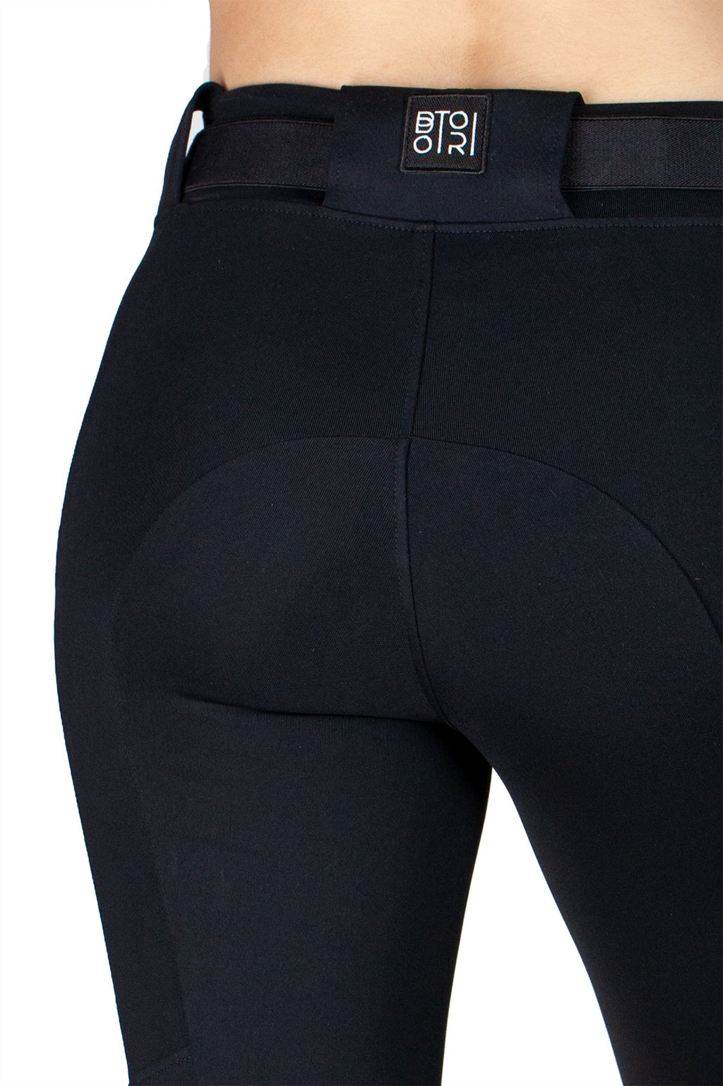 Black riding pants with a visible brand logo on a white background