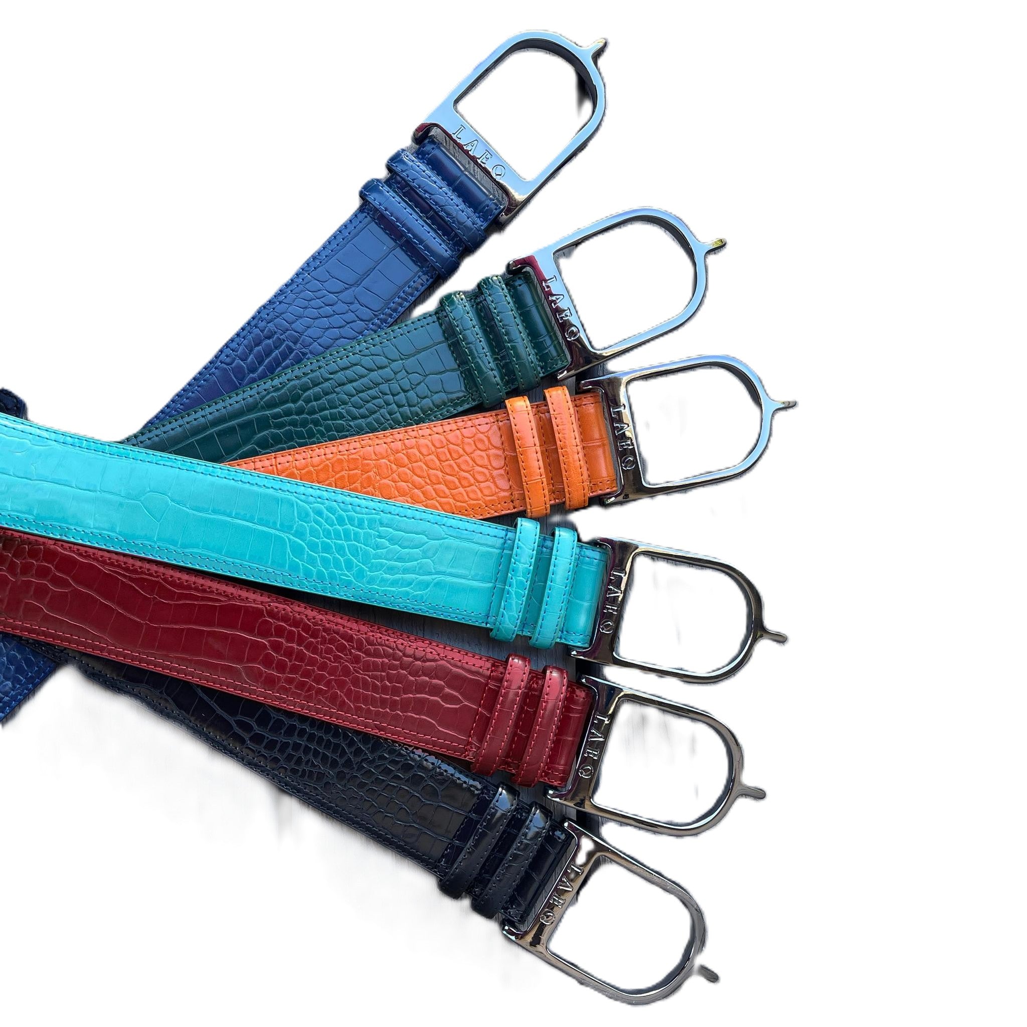 Set of colorful leather straps with metal buckles on a white background
