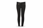 Black riding pants with a brand logo on a beige background