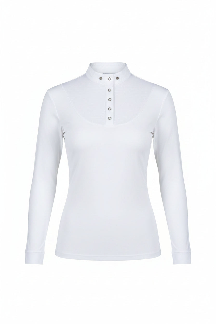 Woman wearing a white long-sleeve top and white pants standing on grass