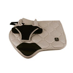 Beige and black saddle pad on a white background