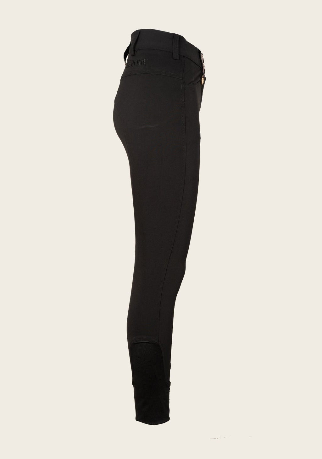 Black riding pants on a beige background
