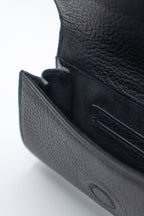 Close-up of a black leather wallet on a white background