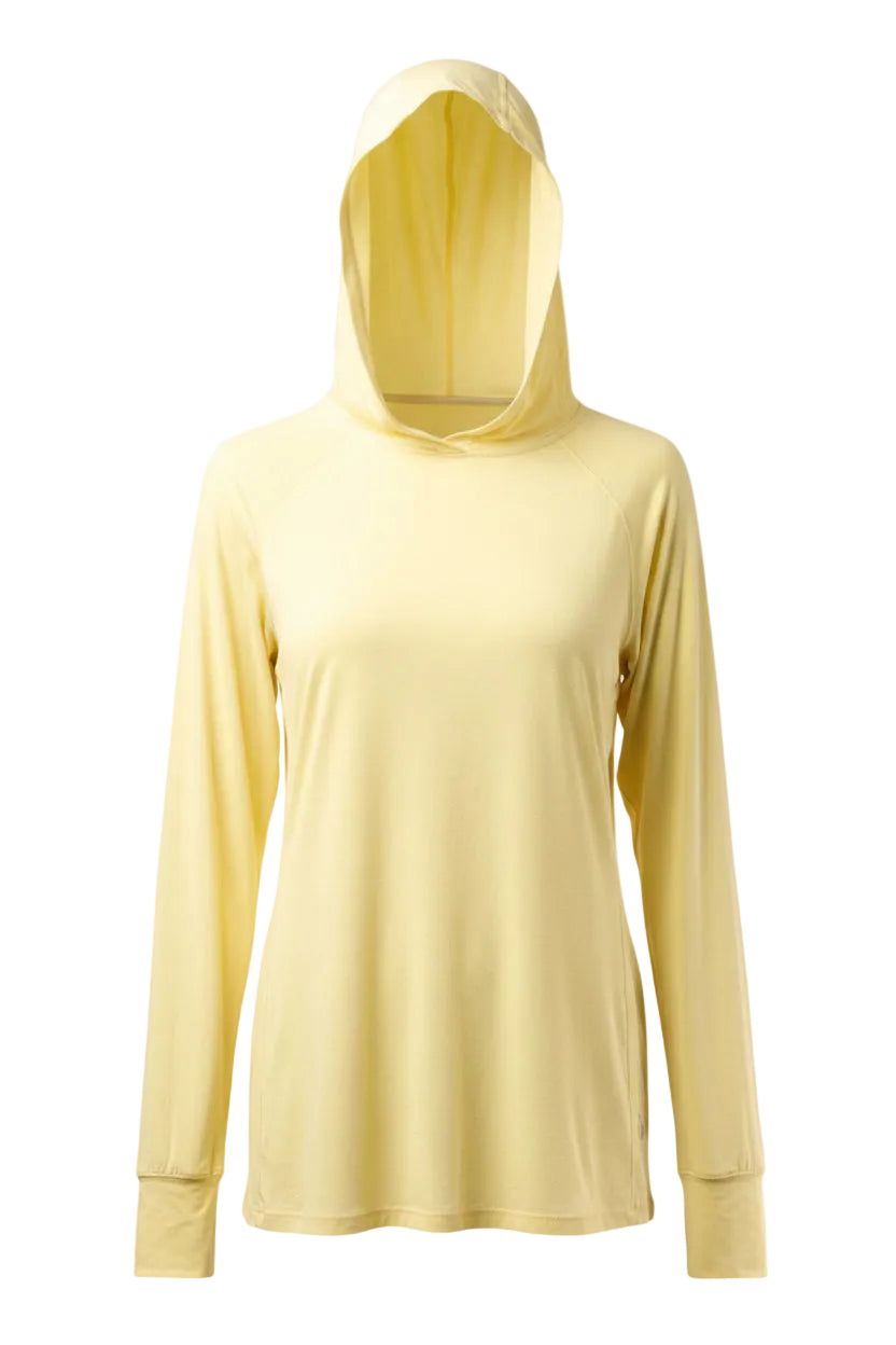 Woman wearing a light yellow long-sleeve top with a hood on a white background