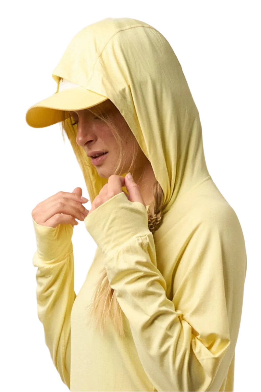 Person wearing a light yellow hoodie and cap on a white background