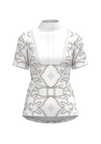 White blouse with intricate black patterns on a beige background