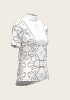 White sleeveless top with floral lace details on a beige background