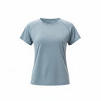 Woman wearing a light blue athletic shirt on a white background