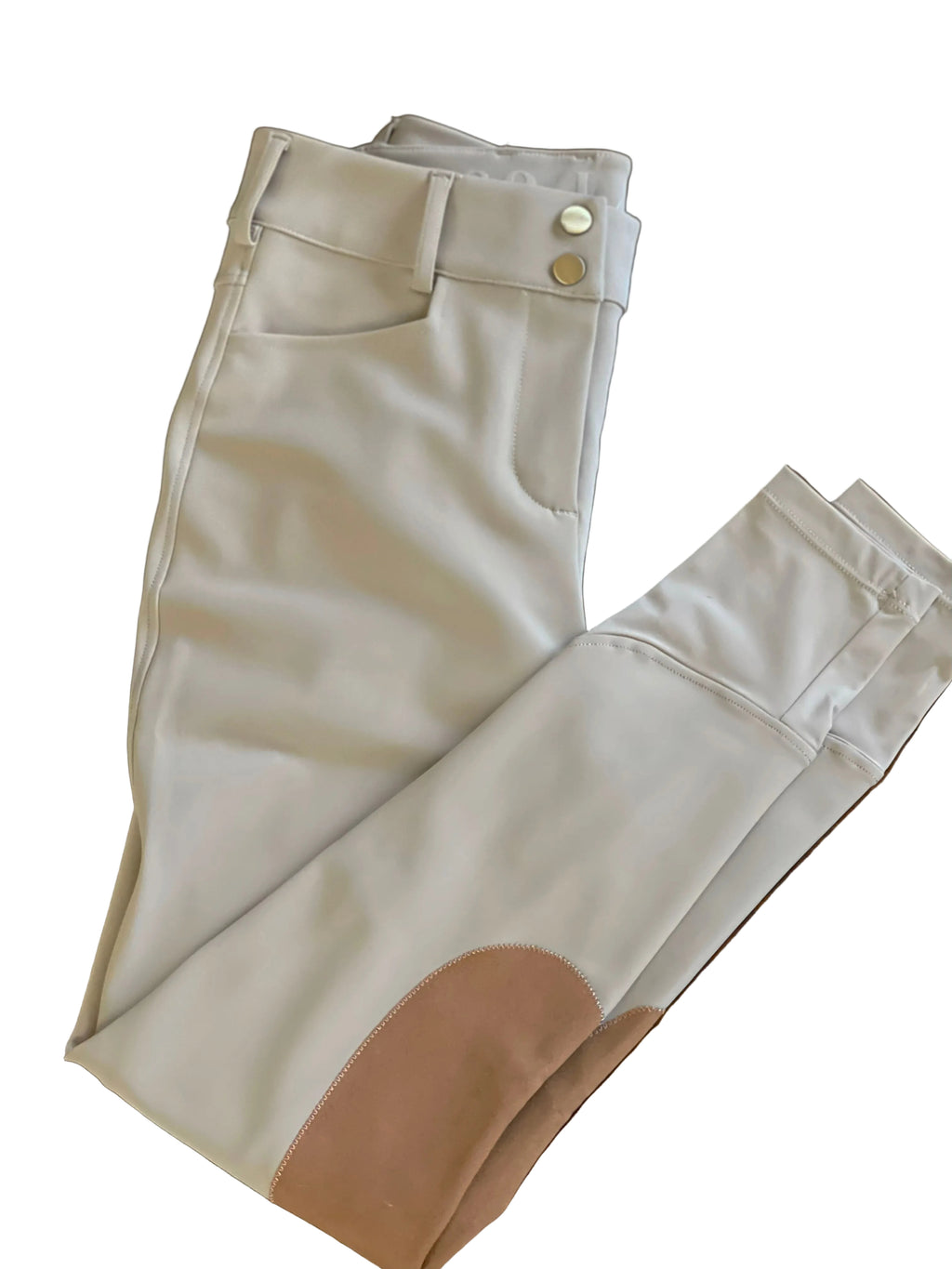 Beige pants with a patch on a wooden surface