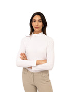 Woman wearing a white sweater and beige pants on a white background