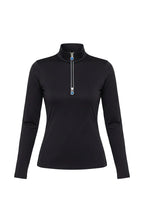 black long-sleeve top with a zipper, standing outdoors near a tree.