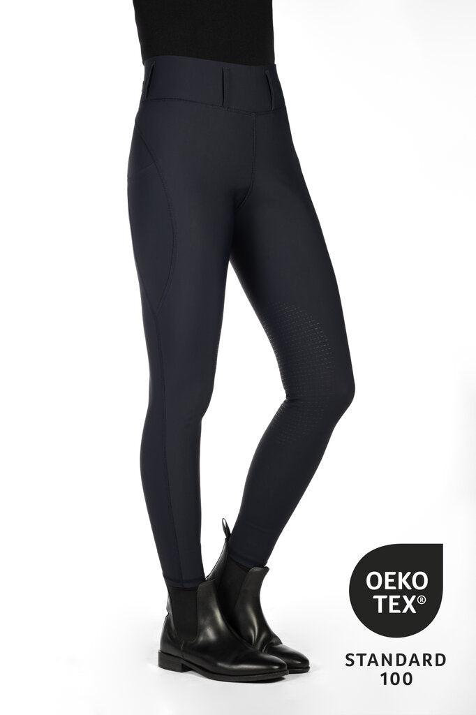 Black riding pants with black boots on a white background, featuring Oeko-Tex certification.