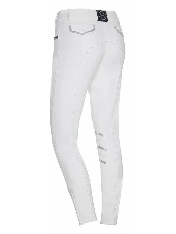 White riding pants with silver details on a white background