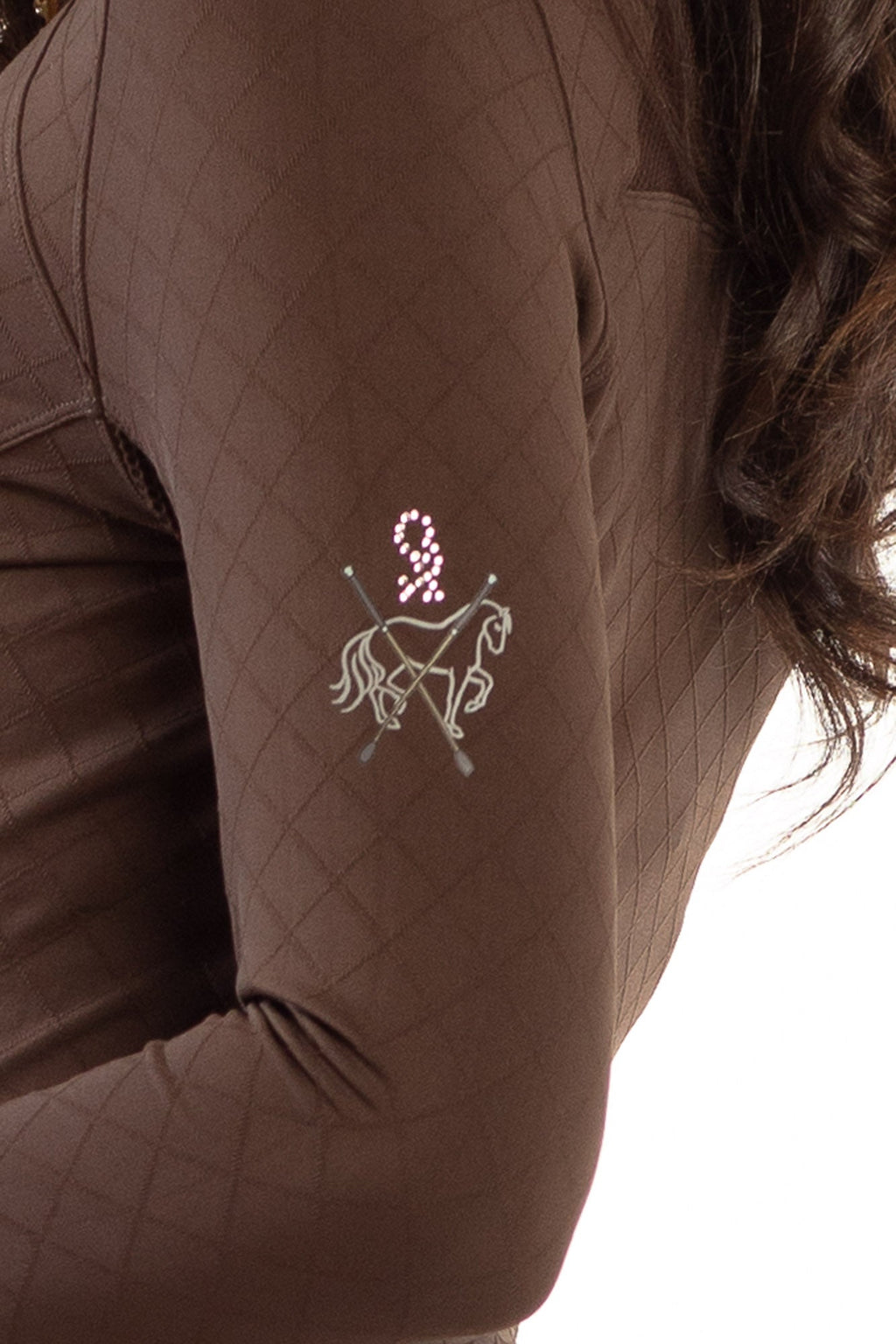 Brown quilted sleeve with embroidered horse design on a white background