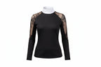  black top with lace sleeves and white pants on a white background