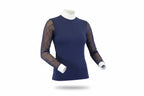 navy blue top with sheer sleeves and white pants on a white background