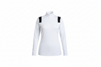  white long-sleeve shirt with black suspenders against a blurred indoor background