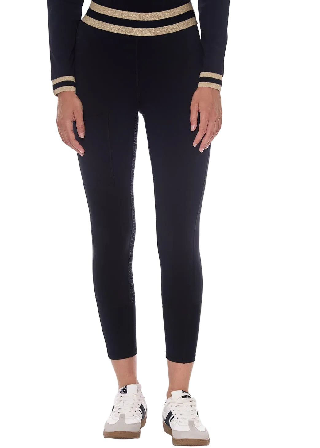 Person wearing black leggings with striped cuffs on a white background