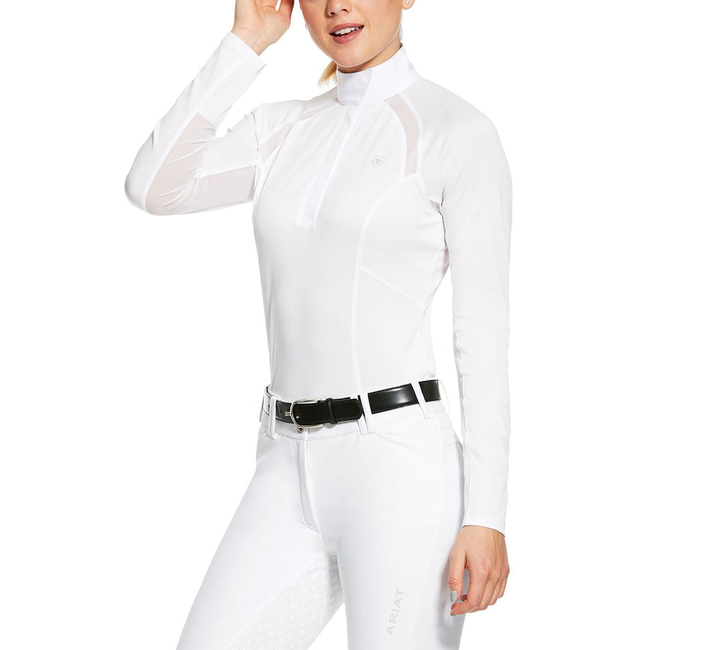 Person wearing a white equestrian jumpsuit with a black belt on a white background