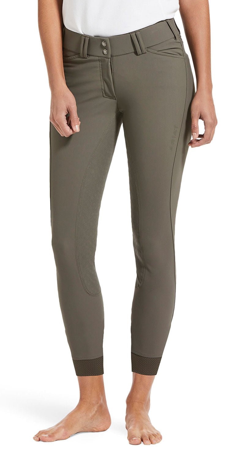 Person wearing olive green pants on a white background