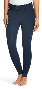Navy riding pants worn by a person on a white background