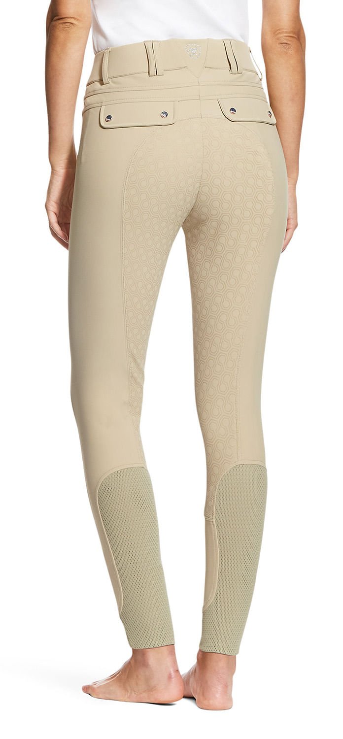 Beige riding pants with knee patches on a white background
