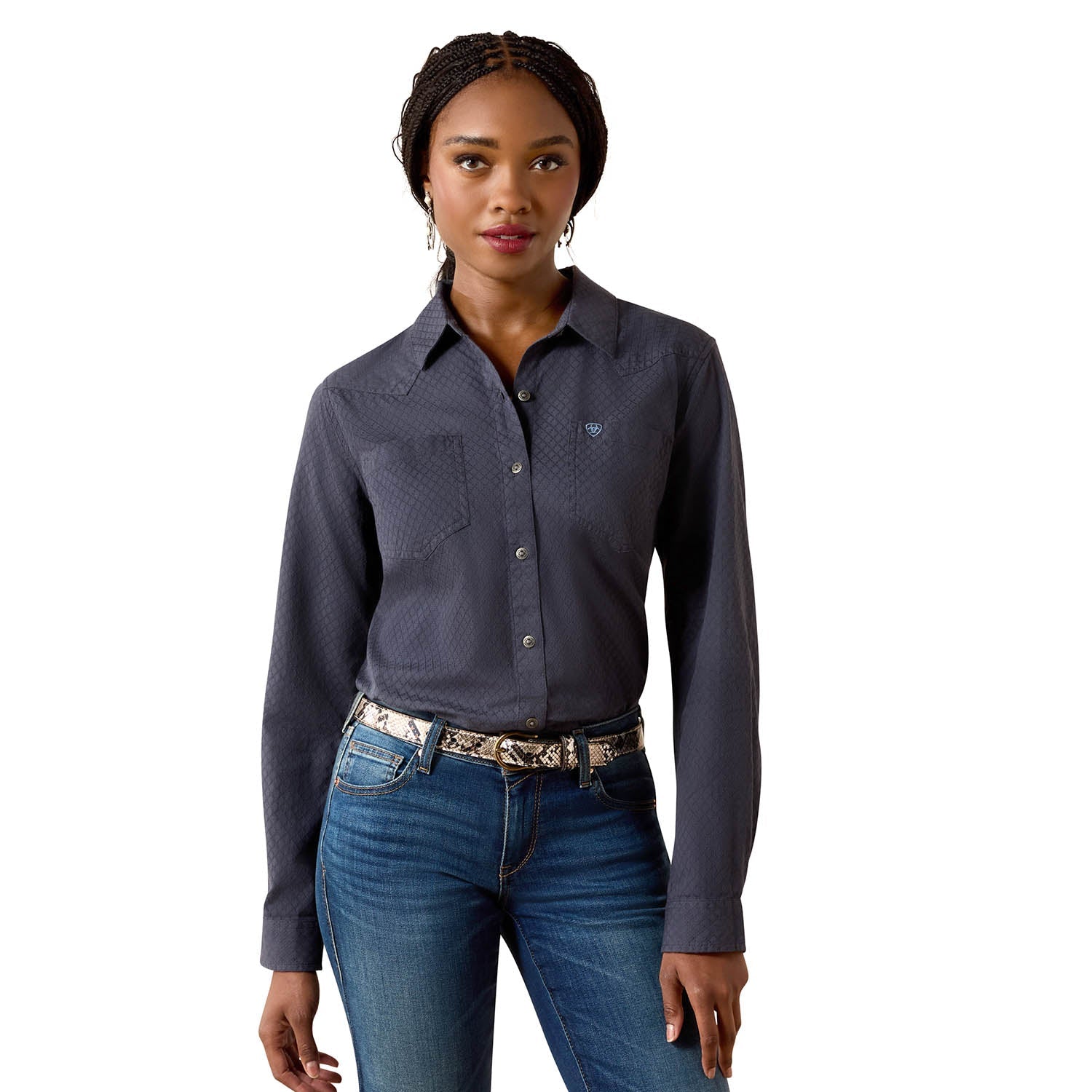 Woman wearing a dark gray button-up shirt and blue jeans on a white background