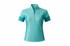 Woman wearing a turquoise athletic shirt and black cap on a white background