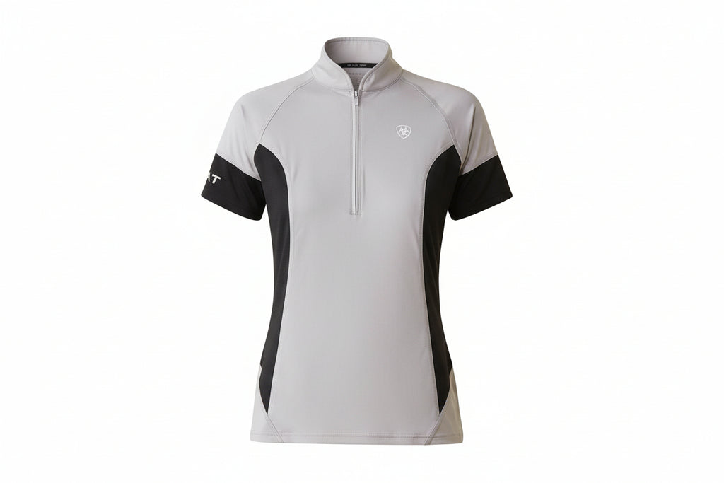 Woman wearing a gray and black cycling jersey with visible branding on a white background